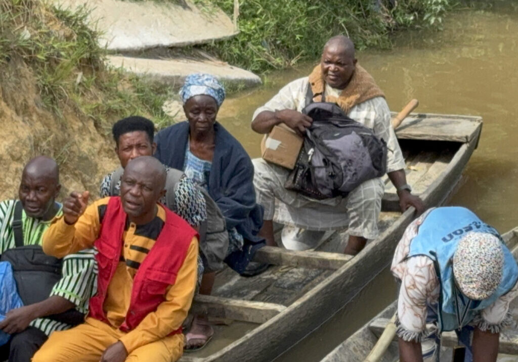 Transporting SonSet radios across Makona River